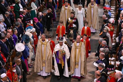 Britain's King Charles III and Queen Camilla depart following their coronation ceremony inside Westminster Abbey in London on May 6, 2023.