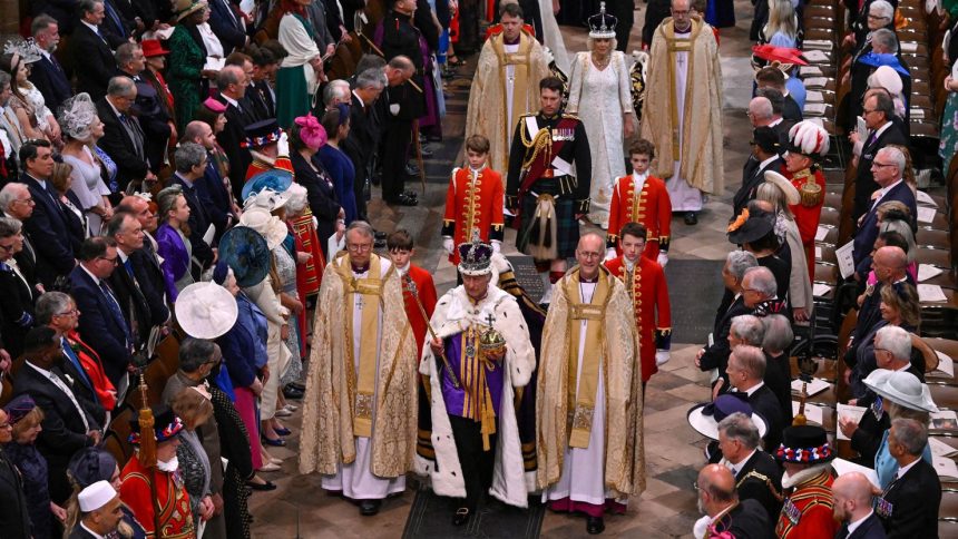 Britain's King Charles III and Queen Camilla depart following their coronation ceremony inside Westminster Abbey in London on May 6, 2023.