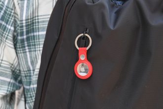 A key ring containing an Air Tag is attached to a rucksack inside the Apple Store in Sydney, Australia.