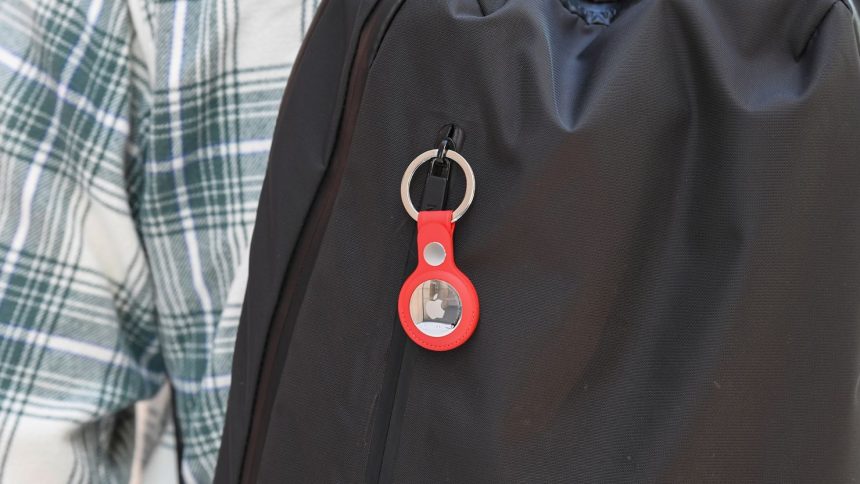 A key ring containing an Air Tag is attached to a rucksack inside the Apple Store in Sydney, Australia.