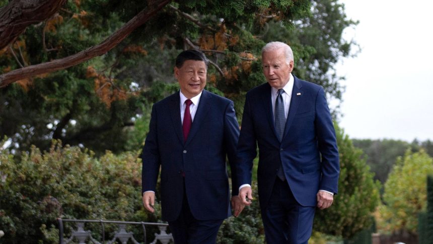 US President Joe Biden and Chinese President Xi Jinping walk together after a meeting during the Asia-Pacific Economic Cooperation (APEC) Leaders' week in Woodside, California on November 15, 2023.