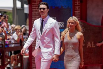 Paul Skenes and Livvy Dunne pose for a photo during the 2024 All-Star Red Carpet Show in Arlington, Texas on July 16.