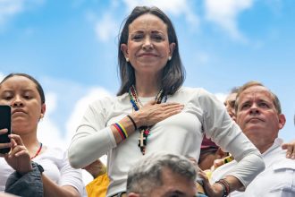 Opposition leader Maria Corina Machado looks on with a hand in her chest during a protest against the result of the presidential election on July 30, 2024 in Caracas, Venezuela.