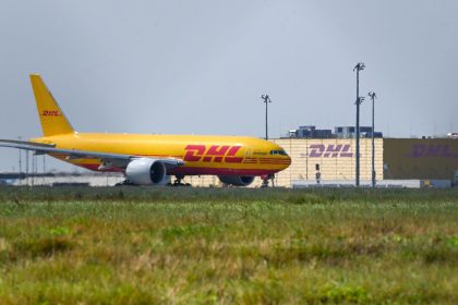 A DHL aircraft in front of the DHL Air Hub at Leipzig, Germany.