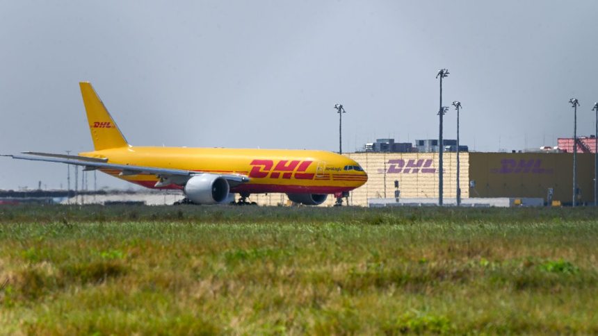 A DHL aircraft in front of the DHL Air Hub at Leipzig, Germany.