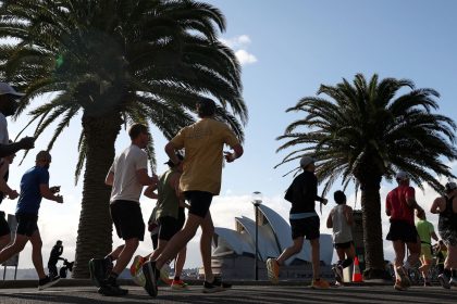 Participants of the Sydney marathon run towards the Opera House on September 15, 2024.