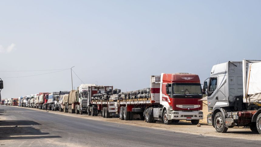 ARISH, EGYPT - OCTOBER 16: Trucks with aid destined for the Gaza Strip are parked on the side of the road on October 16, 2024 in Arish, Egypt. A UK delegation has visited the Al-Arish Hospital, where injured Palestinians are being treated, as well as a warehouse where humanitarian aid has been stored, since the Rafah crossing into Gaza was closed in May. (Photo by Ali Moustafa/Getty Images)