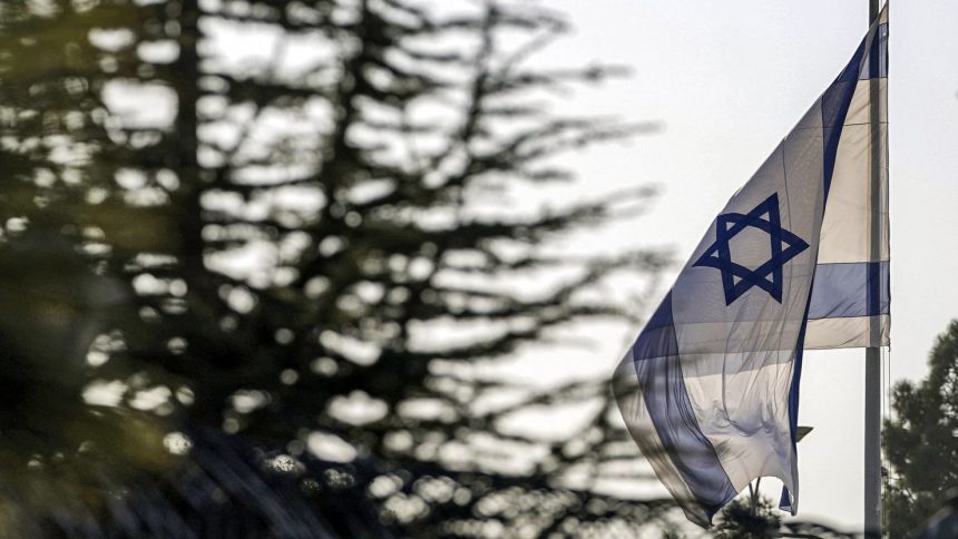 An Israeli flag flies outside the Prime Minister's Office in Jerusalem on October 22, 2024.