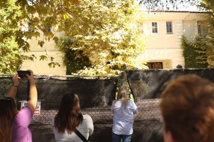 Visitors take photos of the Menendez brothers' former mansion in Beverly Hills, California, on October 23, 2024.