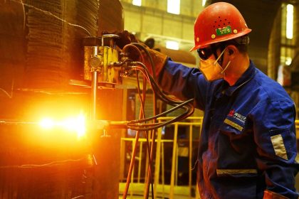 A worker builds petrochemical equipment parts at Lanshi Heavy Machinery in Qingdao, China, on October 31, 2024.