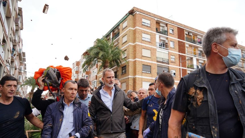 King Felipe is heckled by angry residents during his visit to the Valencia region on Sunday.