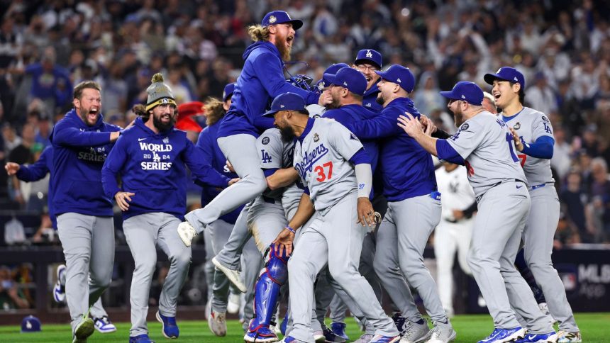 The Los Angeles Dodgers celebrate after they defeated the New York Yankees 7-6 in Game 5 to win the 2024 World Series at Yankee Stadium.