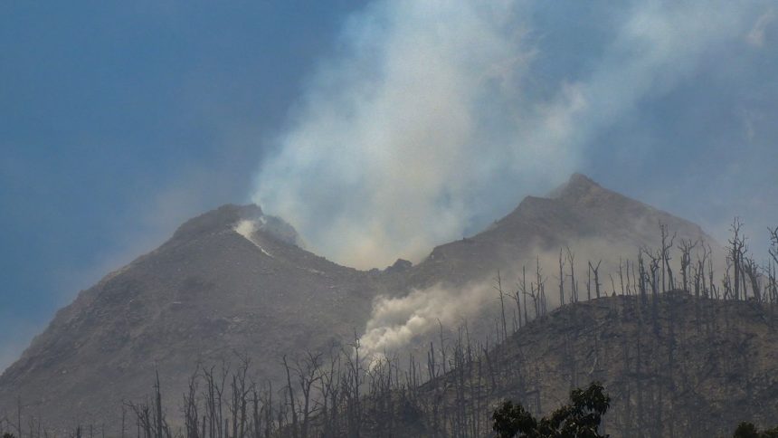 Smoke billows from Mount Lewotobi Laki Laki as seen from Klatanlo village, in East Flores Regency, East Nusa Tenggara, Indonesia on November 4, 2024.