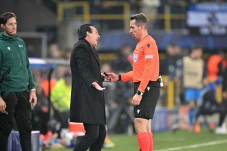 Aston Villa manager Unai Emery argues with German referee Tobias Stieler after the penalty decision.