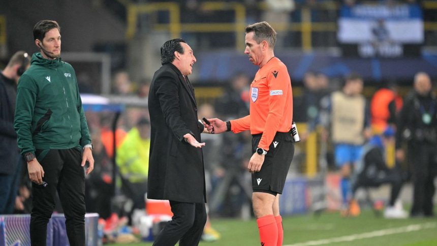 Aston Villa manager Unai Emery argues with German referee Tobias Stieler after the penalty decision.