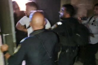 In a screen grab taken from an AFPTV video, Israeli police detain a French consulate staff officer at the  French-owned Eleona church compound in Jerusalem, on November 7, 2024.