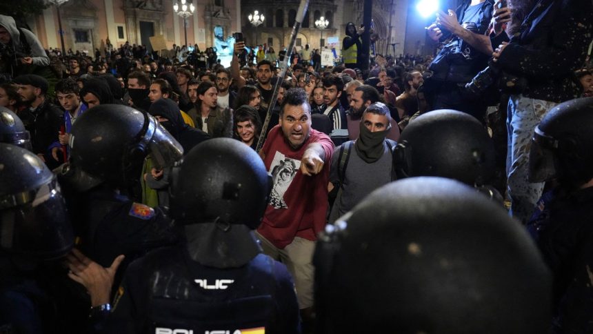 Protesters confront police during a demonstration on November 9 to demand the resignation of Valencia Regional President Carlos Mazon.