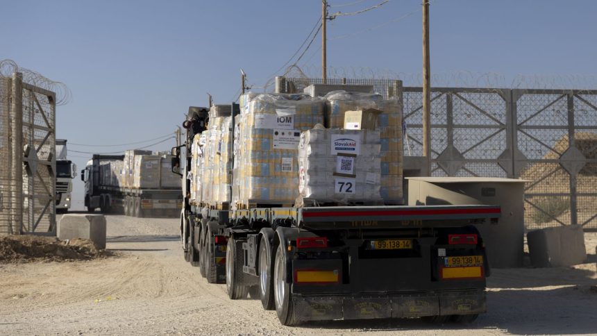 EREZ WEST CROSSING, ISRAEL - NOVEMBER 11: Trucks carrying humanitarian aid cross into the Gaza Strip on November 11, 2024 in Erez West Crossing, Israel. Last month, the UN's Acting Under-Secretary-General for Humanitarian Affairs and Emergency Relief, Joyce Msuya, said that Israel had blocked food aid from entering northern Gaza between October 2-15. According to the UN, more than 1.8 million Palestinians in Gaza are experiencing "extremely critical" levels of hunger. (Photo by Amir Levy/Getty Images)