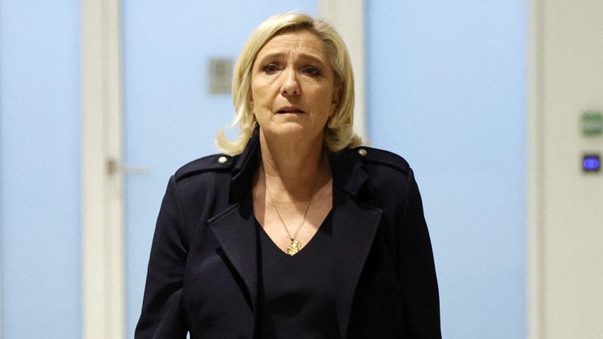 French far-right leader Marine Le Pen arrives at court in Paris on Wednesday.