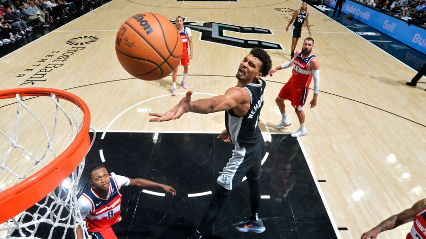 Victor Wembanyama drives to the basket during the San Antonio Spurs' game against the Washington Wizards at the Frost Bank Center.