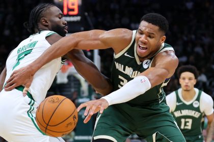 Giannis Antetokounmpo of the Milwaukee Bucks is defended by Jaylen Brown of the Boston Celtics during the first half of the game at Fiserv Forum.