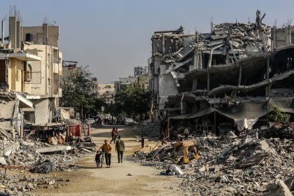 KHAN YUNIS, GAZA - NOVEMBER 15: Palestinians are seen among the rubbles of demolished house as Palestinians try to continue their daily lives despite the destroyed buildings and difficult conditions in Khan Yunis, Gaza on November 15, 2024. (Photo by Abed Rahim Khatib/Anadolu via Getty Images)