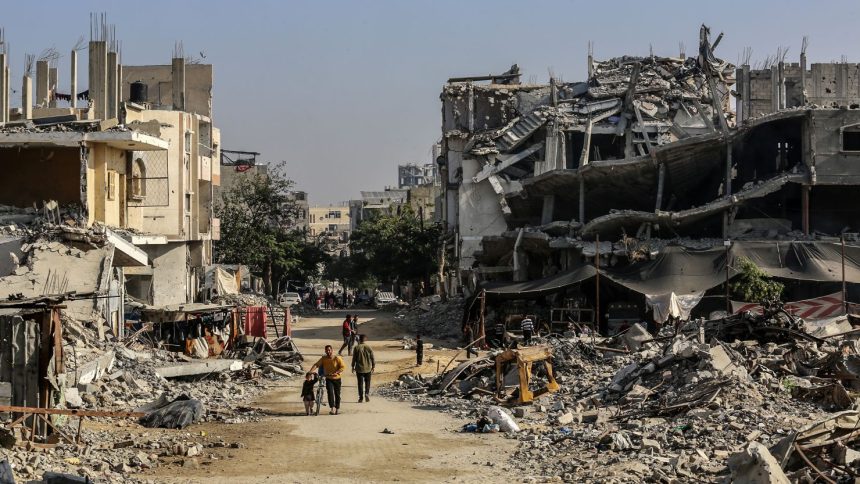 KHAN YUNIS, GAZA - NOVEMBER 15: Palestinians are seen among the rubbles of demolished house as Palestinians try to continue their daily lives despite the destroyed buildings and difficult conditions in Khan Yunis, Gaza on November 15, 2024. (Photo by Abed Rahim Khatib/Anadolu via Getty Images)