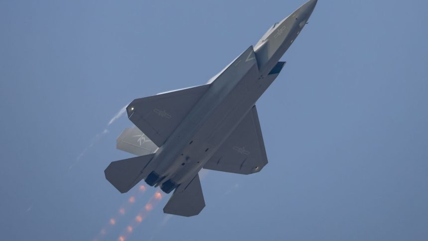 ZHUHAI, CHINA - NOVEMBER 12: A J-35A stealth fighter jet flies in the sky during the 15th China International Aviation and Aerospace Exhibition, or Airshow China 2024, on November 12, 2024 in Zhuhai, Guangdong Province of China. The Airshow China kicks off on November 12 in Zhuhai. (Photo by Chen Jimin/China News Service/VCG via Getty Images)