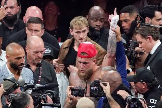 YouTuber and boxer Jake Paul celebrates winning the heavyweight boxing bout against US retired pro-boxer Mike Tyson at The Pavilion at AT&T Stadium in Arlington, Texas, on November 15, 2024.