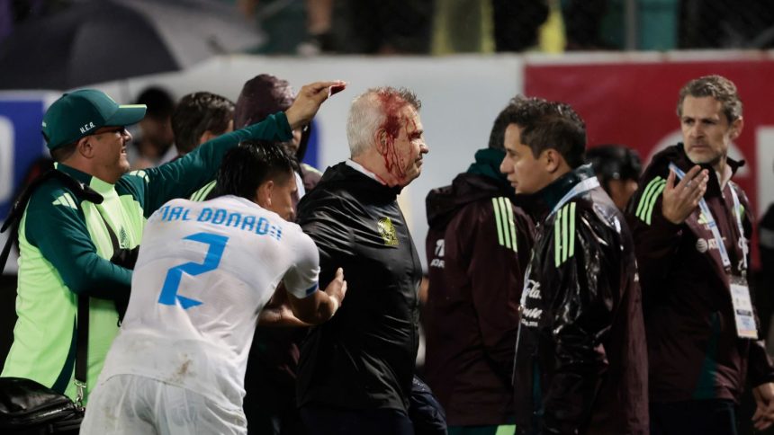 Javier Aguirre sustained a head injury after he was hit by a can thrown from the stands.