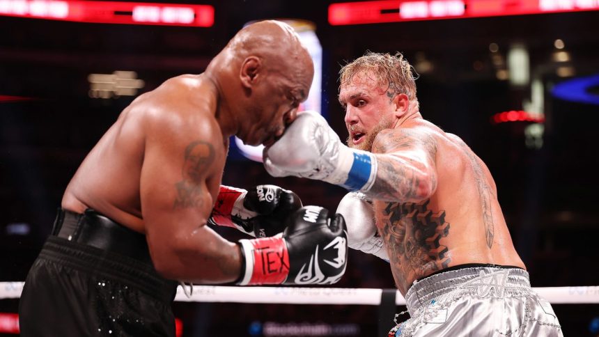 Jake Paul lands a punch on Mike Tyson during their fight at AT&T Stadium in Arlington, Texas, on November 15.