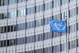 The IAEA flag flutters in the wind outside of the IAEA headquarters during the International Atomic Energy Agency IAEA's Board of Governors meeting at the agency's headquarters in Vienna, Austria, on November 20, 2024.