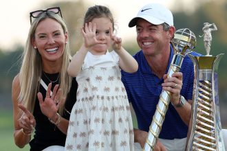 Rory McIlroy celebrates with his wife and daughter after winning his sixth Race to Dubai title.