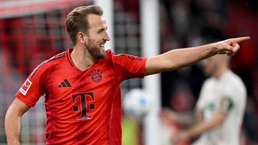 Harry Kane celebrates after scoring against Augsburg in Bayern Munich's 3-0 win.