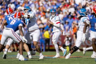 Mississippi Rebels quarterback Jaxson Dart looks for a pass during his team's loss against the Florida Gators.