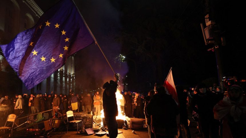 A protester waves a European Union flag during a demonstration in Tbilisi, Georgia, on Thursday.