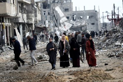 Palestinians return to Nuseirat in the central Gaza Strip following Israeli shelling.