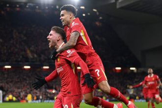 Liverpool's Alexis Mac Allister celebrates with Luis Diaz after scoring the Reds' first goal at Anfield.