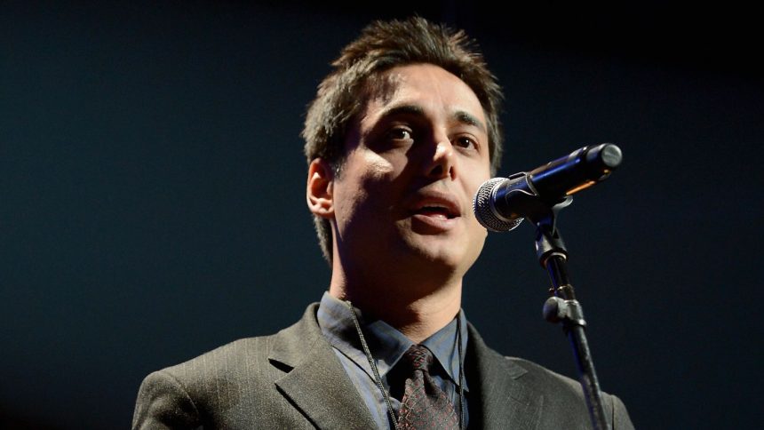 Iranian activist Kianoosh Sanjari speaks on stage at the Amnesty International Concert presented by the CBGB Festival at Barclays Center in New York City, on February 5, 2014.