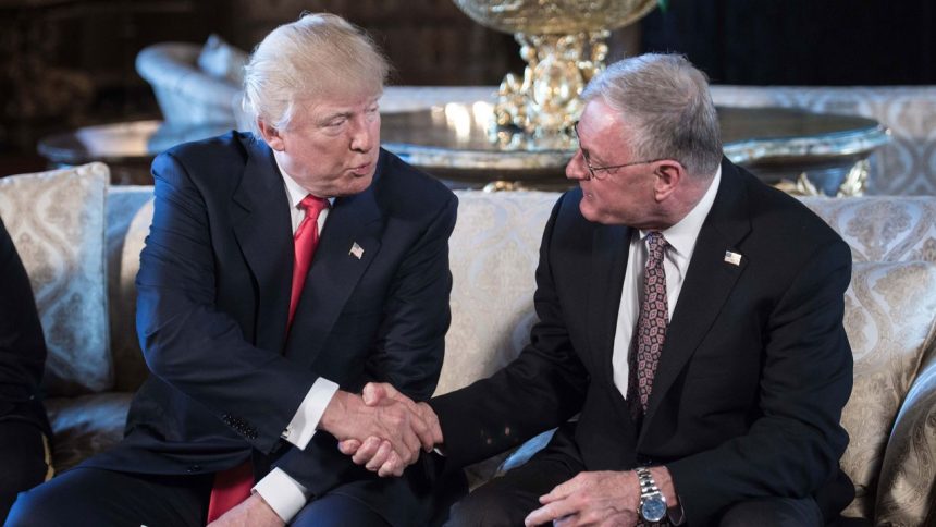 In this 2017 photo, Donald Trump shakes hands with Keith Kellogg in Florida.