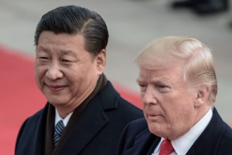 Chinese leader Xi Jinping and then-US President Donald Trump attend a welcome ceremony at the Great Hall of the People in Beijing on November 9, 2017.