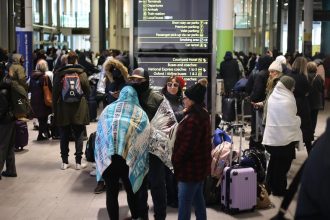 Passengers outside the terminal 4 at Gatwick Airport as a security cordon is in place around the South Terminal.