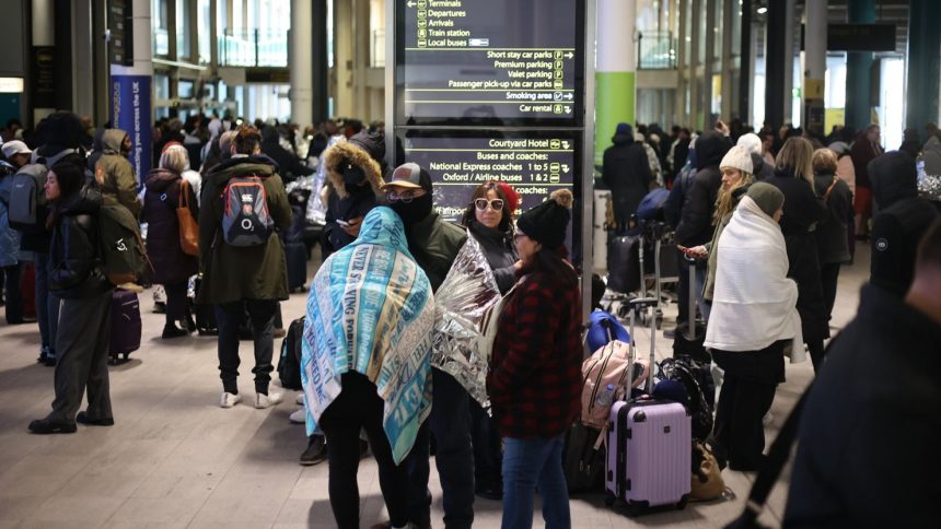 Passengers outside the terminal 4 at Gatwick Airport as a security cordon is in place around the South Terminal.