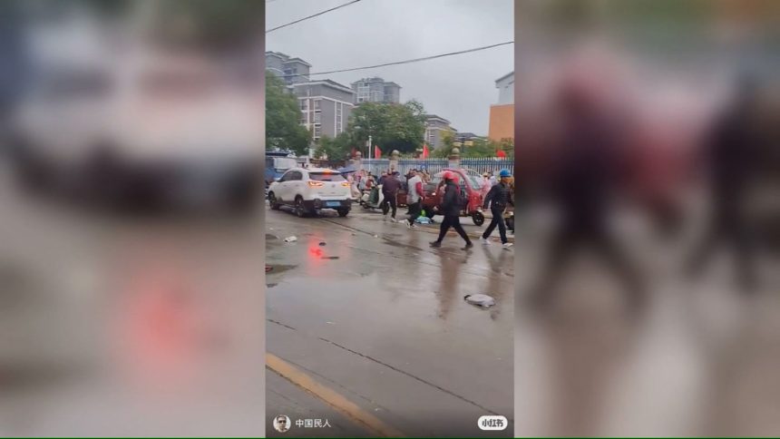 Video circulating on social media showed the road outside the primary school in Changde, Hunan province where multiple people were injured in a car crash.