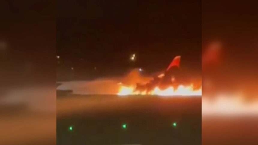 A still from a video by Russian state media RIA Novosti shows a passenger plane on fire at Turkey's Antalya Airport on Sunday, November 24.