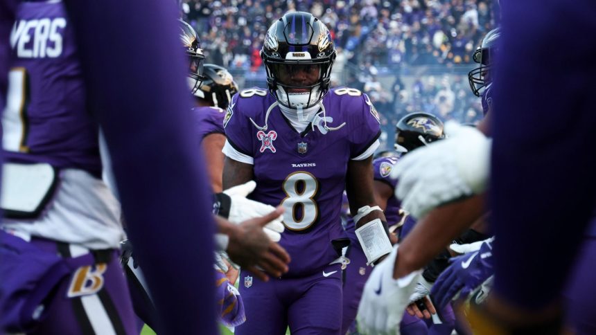 Baltimore Ravens quarterback Lamar Jackson runs onto the field ahead of the game against the Pittsburgh Steelers.