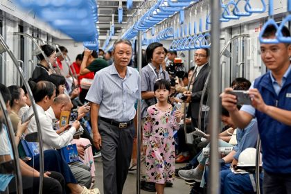 Passengers are seen on a train of the Line 1 of the HCMC Metro in Ho Chi Minh City on December 22, 2024.