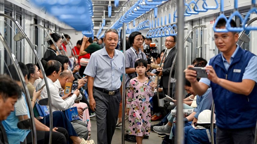 Passengers are seen on a train of the Line 1 of the HCMC Metro in Ho Chi Minh City on December 22, 2024.