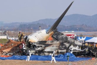 Firefighters and rescue team members work near the wreckage of a passenger plane at Muan International Airport in South Korea on December 29, 2024.