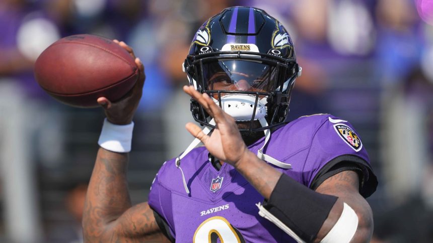 Baltimore Ravens quarterback Lamar Jackson warms up prior to the game against the Washington Commanders at M&T Bank Stadium on October 13.